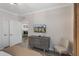 Comfortable bedroom with a flat-screen TV and a view of the kitchen at 1375 Tuscana Ln # 1207, Davenport, FL 33896
