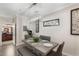 Modern dining room with sleek table, chairs, and stylish decor at 1375 Tuscana Ln # 1207, Davenport, FL 33896