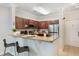 Open kitchen with a breakfast bar, stainless steel appliances, and ample counter space at 1375 Tuscana Ln # 1207, Davenport, FL 33896