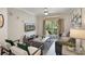 Comfortable living room with a balcony view and modern furnishings at 1375 Tuscana Ln # 1207, Davenport, FL 33896