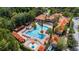 Stunning resort-style pool area with cabanas, lounge chairs, and lush landscaping, creating a relaxing oasis at 1375 Tuscana Ln # 1207, Davenport, FL 33896