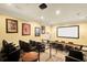 Community theatre room with comfortable seating and projection screen for entertainment at 1375 Tuscana Ln # 1207, Davenport, FL 33896