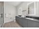 Elegant bathroom featuring dual sinks, a spacious counter, and a sleek, modern design at 1385 Peaceful Nature Way, Clermont, FL 34714