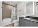 Bathroom featuring modern fixtures, a tub/shower combo, and clean lines at 1385 Peaceful Nature Way, Clermont, FL 34714