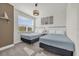 Comfortable bedroom with two twin beds, a bright window, and simple decor at 1385 Peaceful Nature Way, Clermont, FL 34714