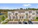 Inviting townhomes with stone accents, manicured landscaping, and convenient parking spaces at 1385 Peaceful Nature Way, Clermont, FL 34714