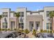 Charming townhome featuring a stone facade, tidy landscaping, and a welcoming entrance at 1385 Peaceful Nature Way, Clermont, FL 34714
