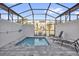 Private screened-in pool featuring relaxing lounge chairs and an inviting outdoor space at 1385 Peaceful Nature Way, Clermont, FL 34714