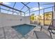 Serene private pool with relaxing lounge chairs and views of nearby buildings at 1385 Peaceful Nature Way, Clermont, FL 34714