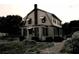 Historic two story home with gambrel roof and brick chimney at 1400 Florida Ave, St Cloud, FL 34769