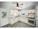 Bright, well-lit kitchen with clean white cabinetry, modern appliances, and sleek gray countertops at 1400 Florida Ave, St Cloud, FL 34769