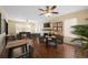 Versatile living room with fireplace, ceiling fan, and flexible layout with hardwood floors at 1400 Florida Ave, St Cloud, FL 34769