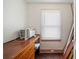 Small room with wood floors, an air conditioning unit, and a window with blinds at 1400 Florida Ave, St Cloud, FL 34769