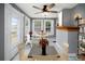 Bright sun room with large windows, tile floors, a ceiling fan, and seating for cafe-style dining at 1400 Florida Ave, St Cloud, FL 34769