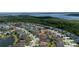 Wide aerial shot of the property and surrounding suburban neighborhood with lake views at 1532 Angler Ave, Kissimmee, FL 34746