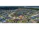 Aerial view of a lakeside community highlighting the property with a red pin at 1532 Angler Ave, Kissimmee, FL 34746