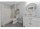 Charming bathroom featuring a shower-tub, toilet, and a white vanity with marble countertop at 1532 Angler Ave, Kissimmee, FL 34746