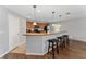 Kitchen featuring a breakfast bar and a combination of tile and hardwood flooring at 1532 Angler Ave, Kissimmee, FL 34746