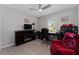 Cozy living room with a fireplace, comfortable chair and natural light at 1532 Angler Ave, Kissimmee, FL 34746