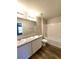 Bathroom featuring double vanity, large mirror, tile floors, and shower-tub combination at 158 Violet Ct, Poinciana, FL 34759