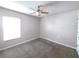 Bedroom featuring neutral walls, carpeting, and bright window at 158 Violet Ct, Poinciana, FL 34759