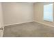 Neutral bedroom with plush carpeting, ceiling fan and a bright window at 158 Violet Ct, Poinciana, FL 34759