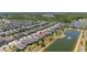 Community aerial view showcasing the home, streets, and pond, providing a sense of place at 17324 Bracken Fern Ln, Clermont, FL 34714