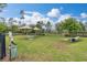 A well-maintained dog park with shaded seating and play equipment, perfect for pet owners at 17324 Bracken Fern Ln, Clermont, FL 34714