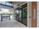 Modern fitness center entrance with glass doors and 'Fitness' sign in a well-designed community recreational area at 17324 Bracken Fern Ln, Clermont, FL 34714