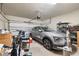 Spacious two-car garage with ample storage and an electric door at 17324 Bracken Fern Ln, Clermont, FL 34714