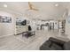 Open-concept living area featuring a spacious layout and direct access to the kitchen with stainless appliances at 17324 Bracken Fern Ln, Clermont, FL 34714