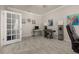 Versatile office space with tile flooring, crown molding, and bright natural light at 17324 Bracken Fern Ln, Clermont, FL 34714