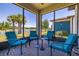Inviting screened patio with brick flooring and comfortable seating with lake view at 17324 Bracken Fern Ln, Clermont, FL 34714