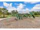 Well-maintained playground with modern equipment, surrounded by lush landscaping, promoting active outdoor play at 17324 Bracken Fern Ln, Clermont, FL 34714