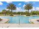 Beautiful community pool featuring palm trees, lounge chairs and a large pool for residents to enjoy at 17324 Bracken Fern Ln, Clermont, FL 34714