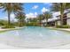 Inviting community pool featuring water fountains and shallow areas, enhancing the aquatic experience with playful elements at 17324 Bracken Fern Ln, Clermont, FL 34714