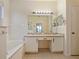 Primary bathroom with soaking tub, dual vanities, and lots of natural light at 1976 The Oaks Blvd, Kissimmee, FL 34746