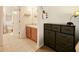 Simple bathroom featuring a vanity with sink, toilet, and tile flooring at 1976 The Oaks Blvd, Kissimmee, FL 34746