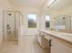 Bathroom with walk in shower, soaking tub and double sink vanity at 1976 The Oaks Blvd, Kissimmee, FL 34746