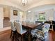 Bright dining room featuring a modern chandelier, hardwood floors, and comfortable seating at 1976 The Oaks Blvd, Kissimmee, FL 34746