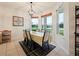 Dining room with view, table with seating for six and tile floors at 1976 The Oaks Blvd, Kissimmee, FL 34746