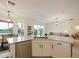 Bright kitchen features modern appliances, granite countertops, and ample cabinet space at 1976 The Oaks Blvd, Kissimmee, FL 34746
