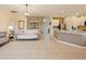 Open-concept living room with tile flooring, neutral paint, and modern furnishings at 1976 The Oaks Blvd, Kissimmee, FL 34746