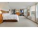 Spacious main bedroom with natural light, hardwood furnishings, and a large walk-in closet at 1976 The Oaks Blvd, Kissimmee, FL 34746