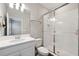 Bathroom featuring glass shower, white vanity with sink, and neutral paint colors at 2110 Old Hollow Ln, Clermont, FL 34715