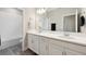 Well-lit bathroom with dual sinks and vanity at 2110 Old Hollow Ln, Clermont, FL 34715
