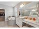 Bright bathroom with garden tub, walk-in shower, double sinks and vanity at 2110 Old Hollow Ln, Clermont, FL 34715