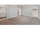 Spacious bedroom with carpet and easy access to bathroom and walk-in closet at 2110 Old Hollow Ln, Clermont, FL 34715