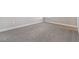 Spacious room featuring carpet flooring, neutral paint and trim and lots of light at 2110 Old Hollow Ln, Clermont, FL 34715