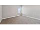 Bedroom features carpet flooring, a window letting in natural light, and neutral wall color at 2110 Old Hollow Ln, Clermont, FL 34715